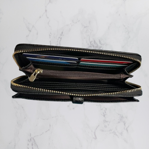 Inside of black wallet by Moana Road.