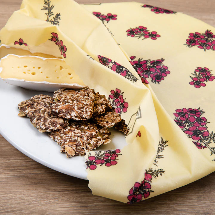 Honeywrap used to wrap a plate of cheese and crackers