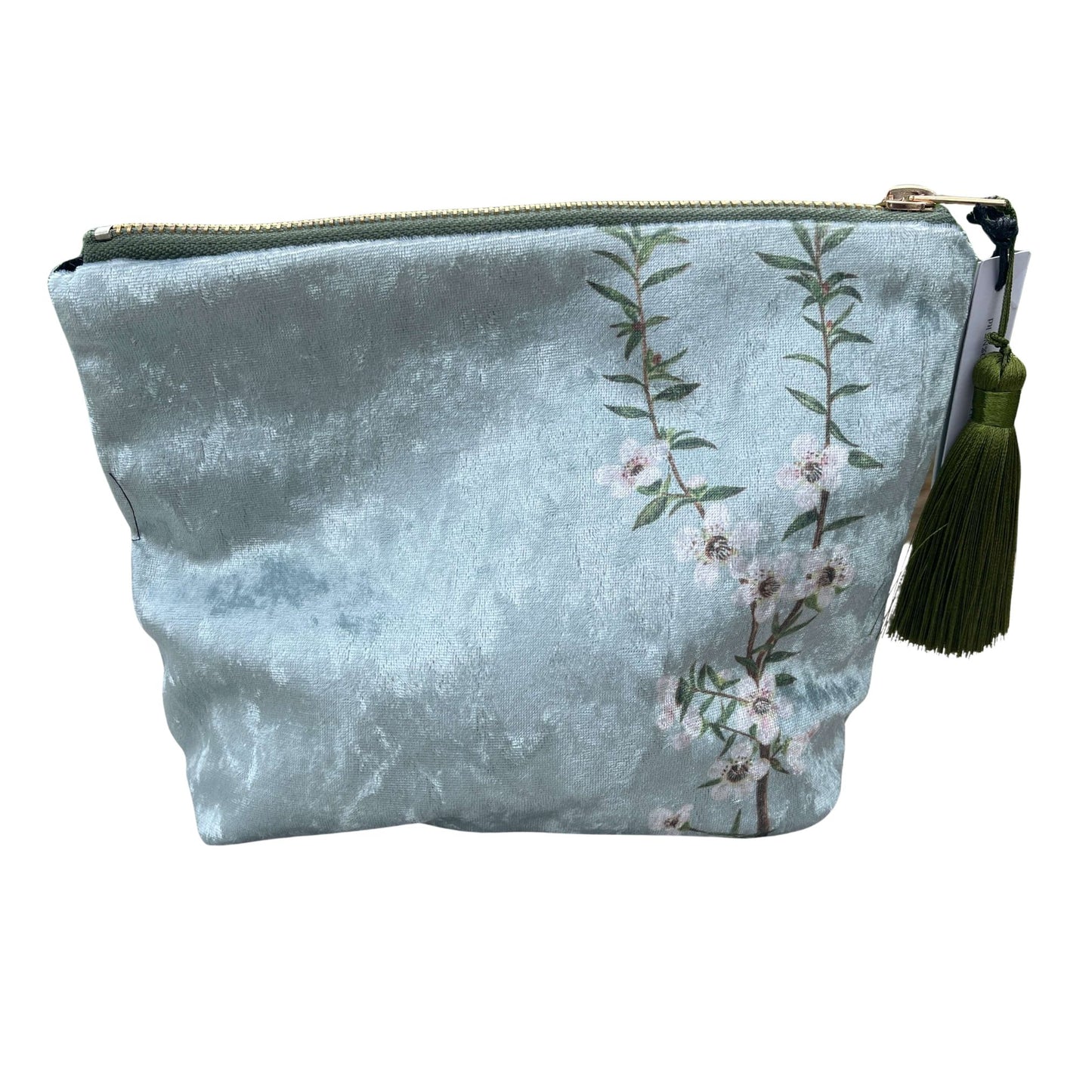 Icy blue velvet cosmetic bag with Manuka flowers and a green tassel.