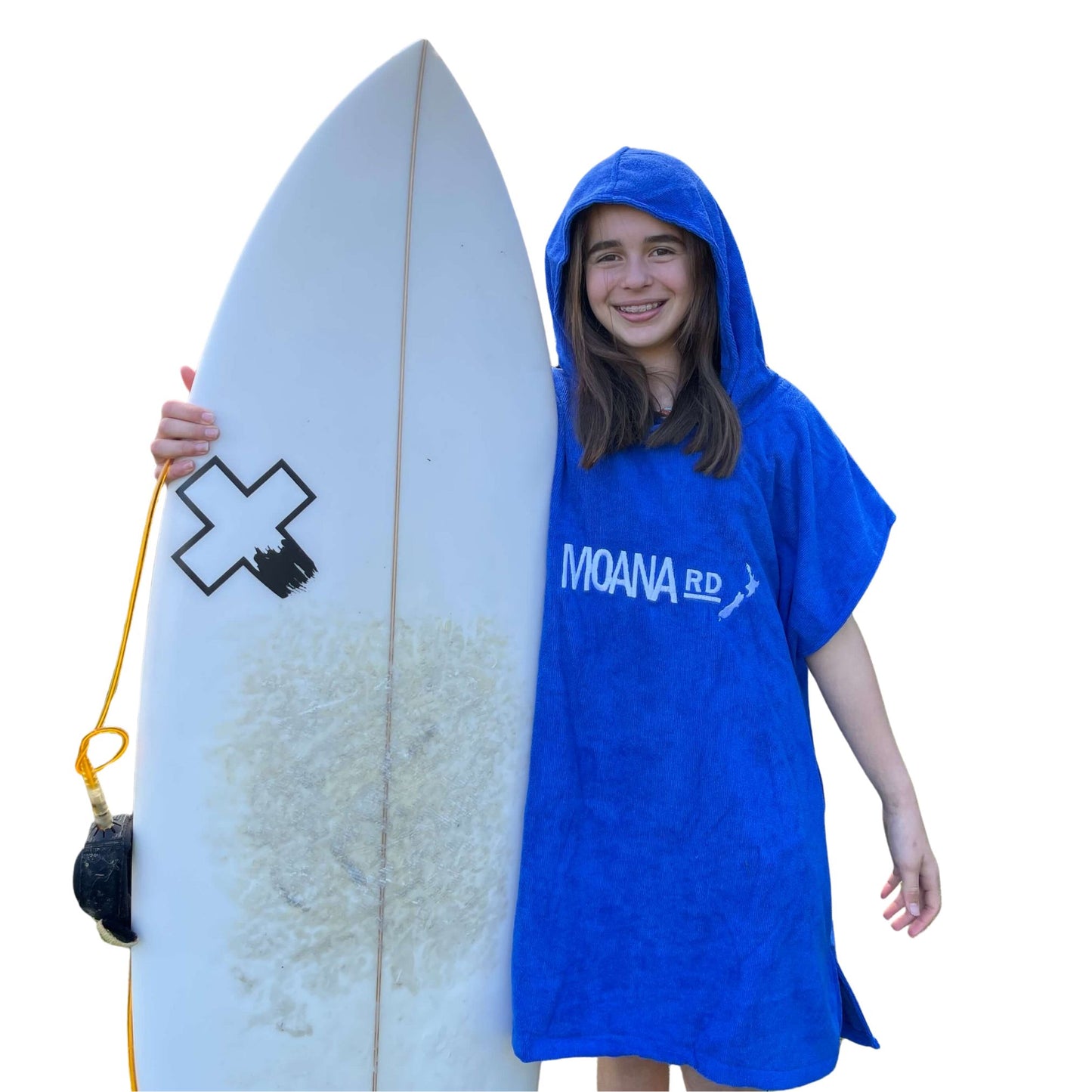 Young girl wearing a blue towel hoodie with the words Moana RD on it in white and a map of New Zealand. She is holding a surfboard.