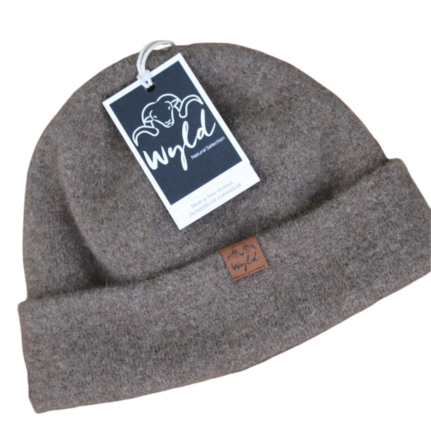 Portrait of a woman wearing a Wyld knit woolen beanie.