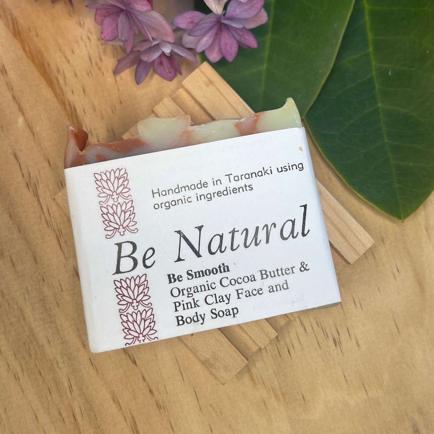 Natural soap bar on a wooden soap rack.