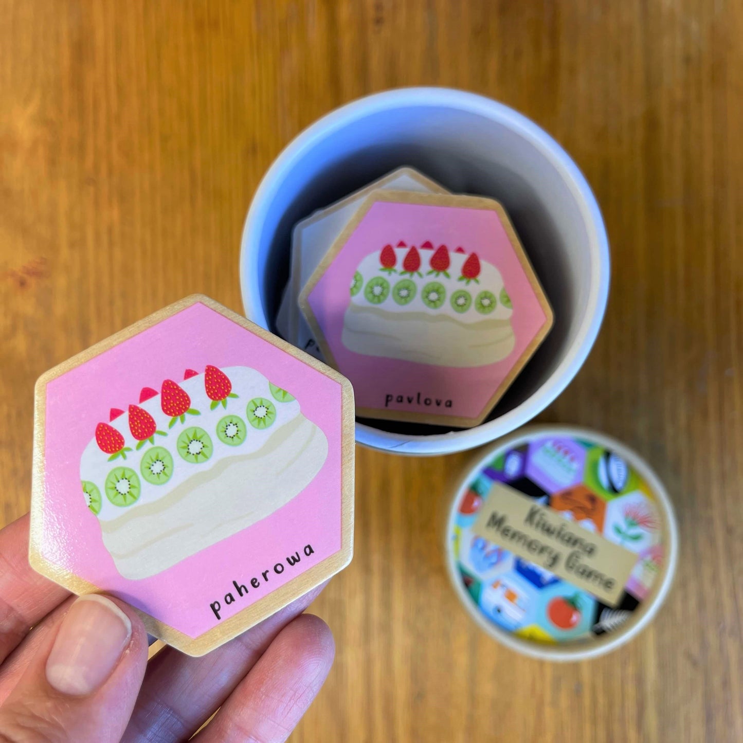Wooden hexagon blocks featuring Pavlova dessert as part of a Kiwiana Memory Game.