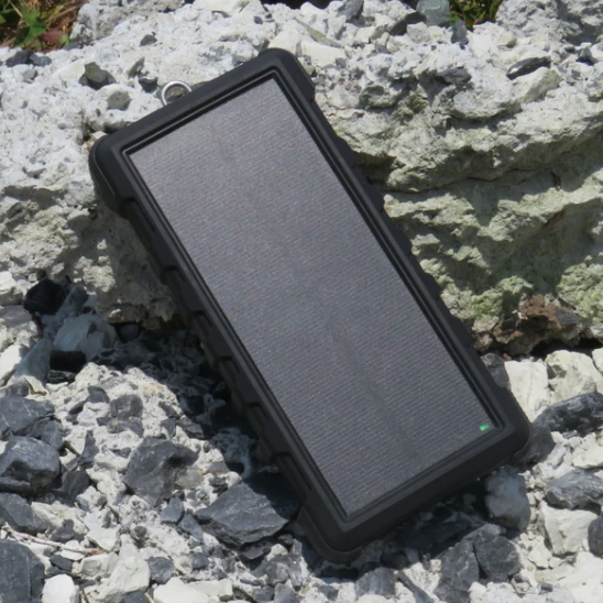 SunSaver 24K, 24,000mAh Solar Power Bank on rocks in the sun