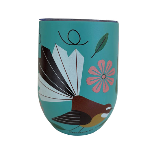 A teal insulated tumbler with a Fantial bird and pink flower illustration.