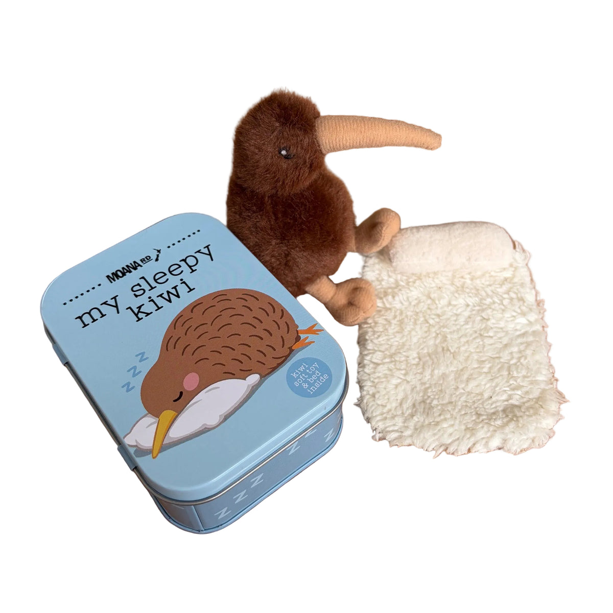 A plush brown kiwi toy with a long tan beak sits beside a small light blue tin labeled 'my sleepy kiwi' and a white textured blanket.