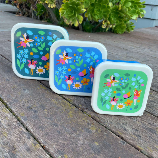 Set of 3 snack boxes in shades of blue and green with a fairy garden print on each lid.