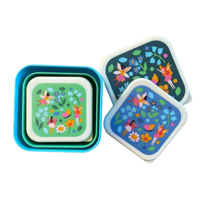 Set of 3 stacking snack boxes in shades of blue and green with a fairy garden print on each lid.