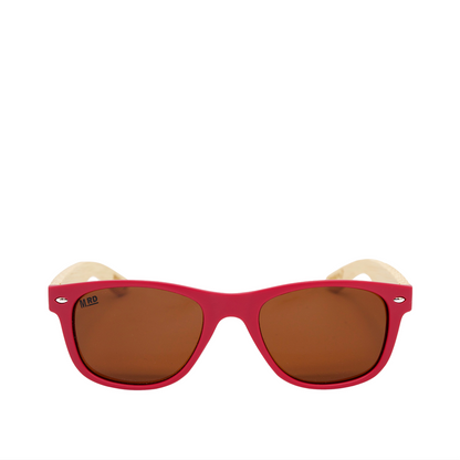 A pair of kids sunglasses with a bright pink frame, brown mirrored lenses, and light wooden arms, shown against a plain white background.