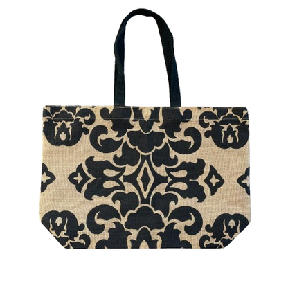 Woven jute tote bag with black damask style print and black cotton handles.