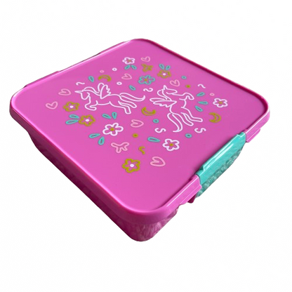 Bright pink kids lunchbox with a teal latch and white, mustard and teal unicorn and flower print on the lid.