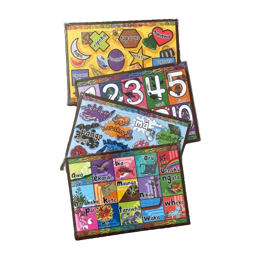 Four colourful tray puzzles featuring maori numbers and words.