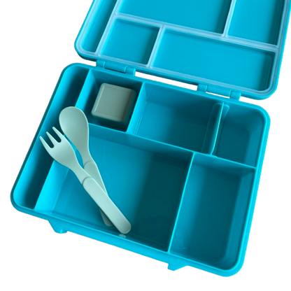 Kids bright blue bento style lunch box showing the inside compartments and cutlery accessories.