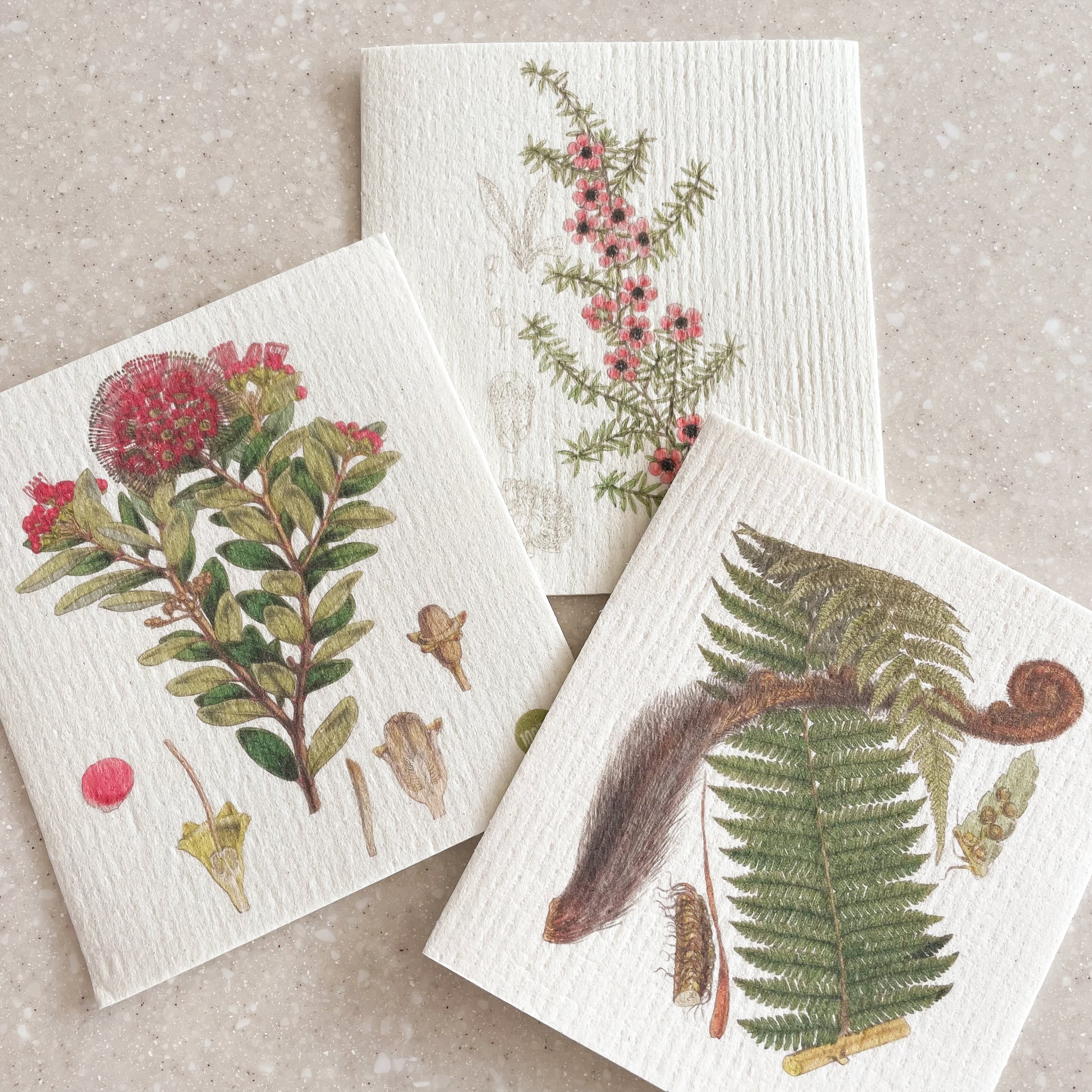 Set of 3 Swedish dishcloths featuring native New Zealand botanical images; Northern Rata, Manuka and Tree Fern.