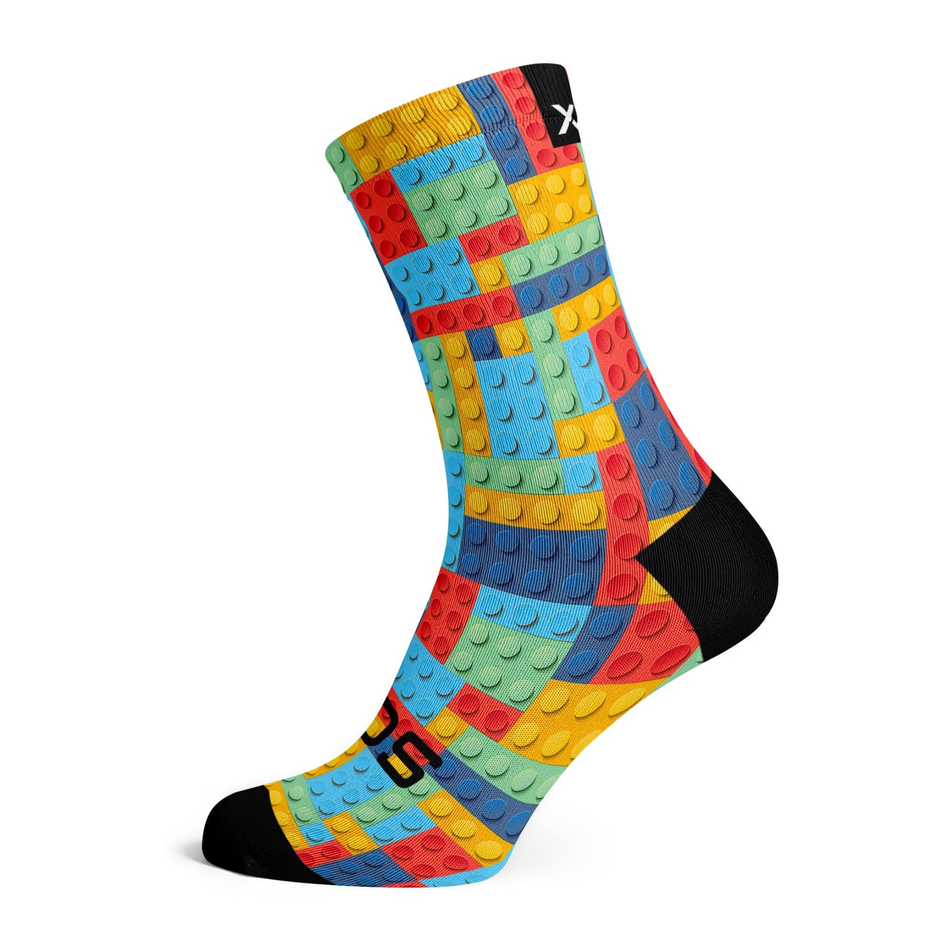 Multi-coloured block kids block style sock on white background