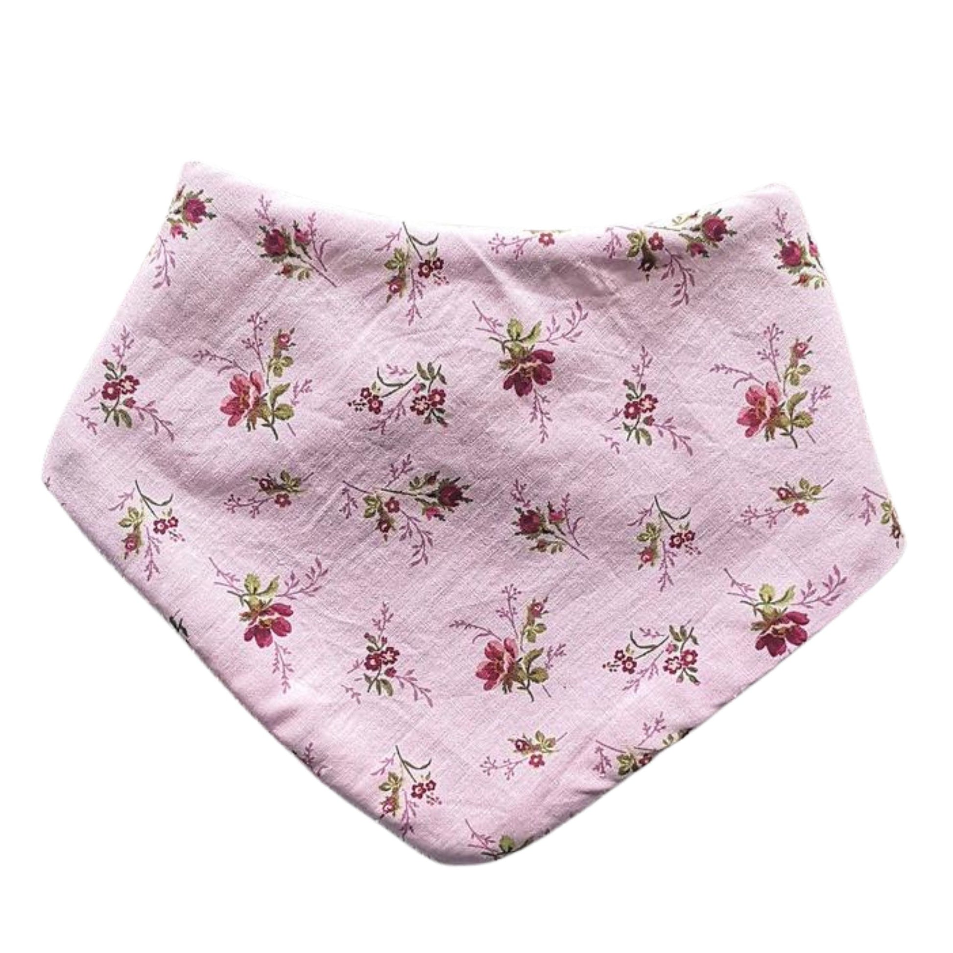 Baby dribble bib in pink with maroon and pink floral print.