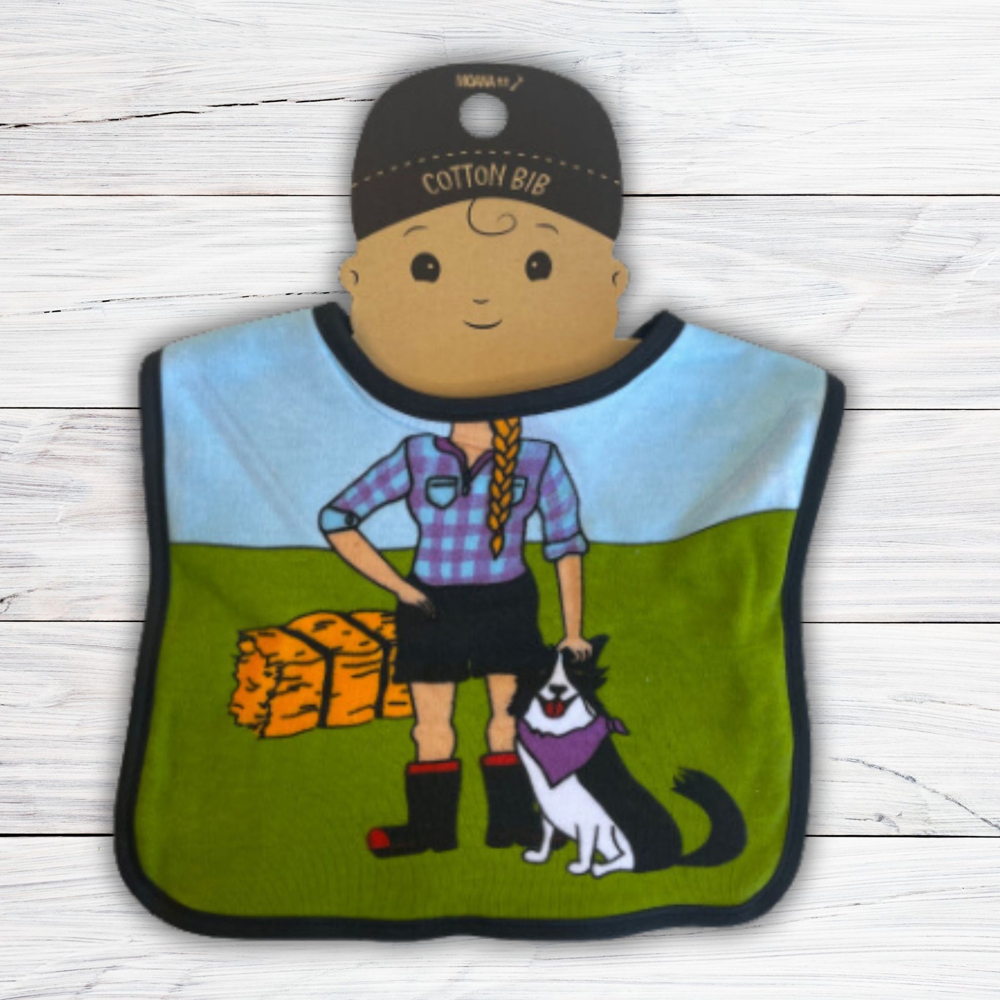 Baby bib with a farmer girls body, a farm dog and a bale of hay.