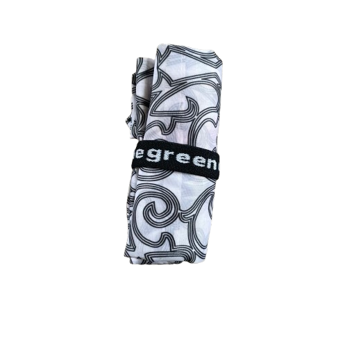 Nylon tote bag in white with a black decorative pattern rolled up to pocket size.