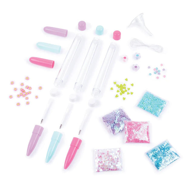 Glitter float pen craft kit pieces.