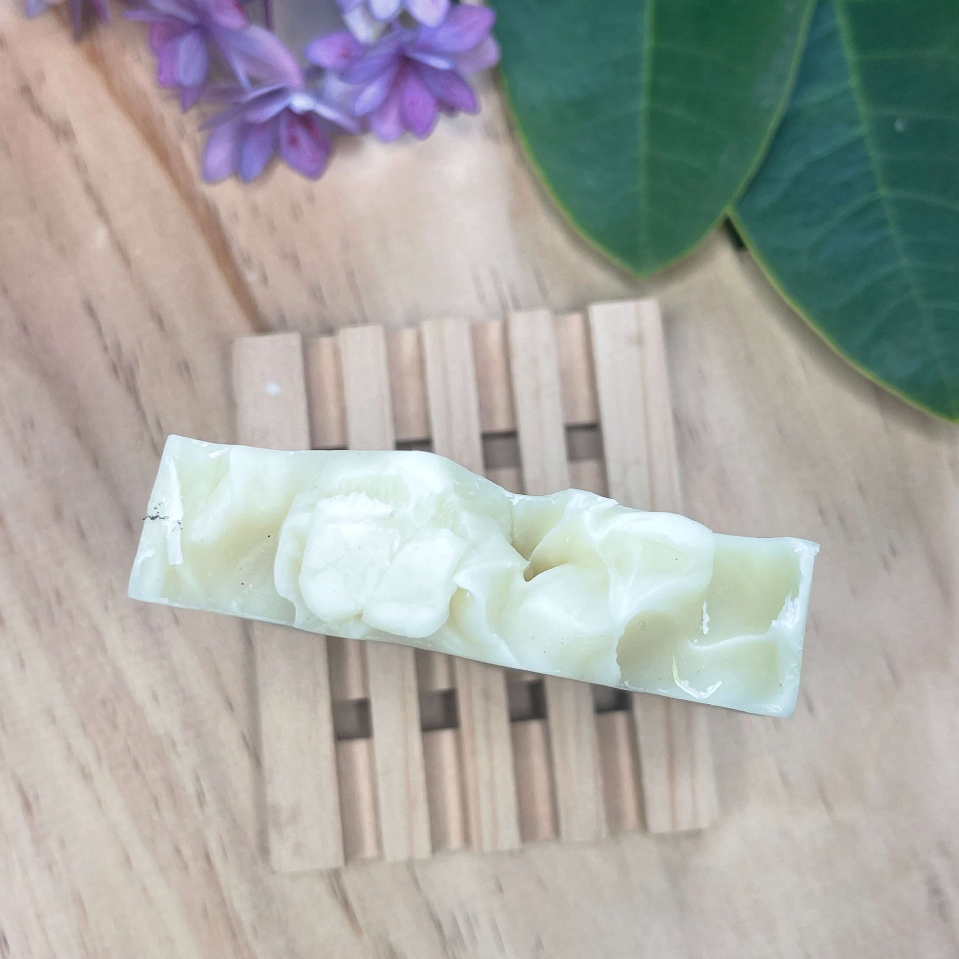 Natural soap on a wooden soap rack.