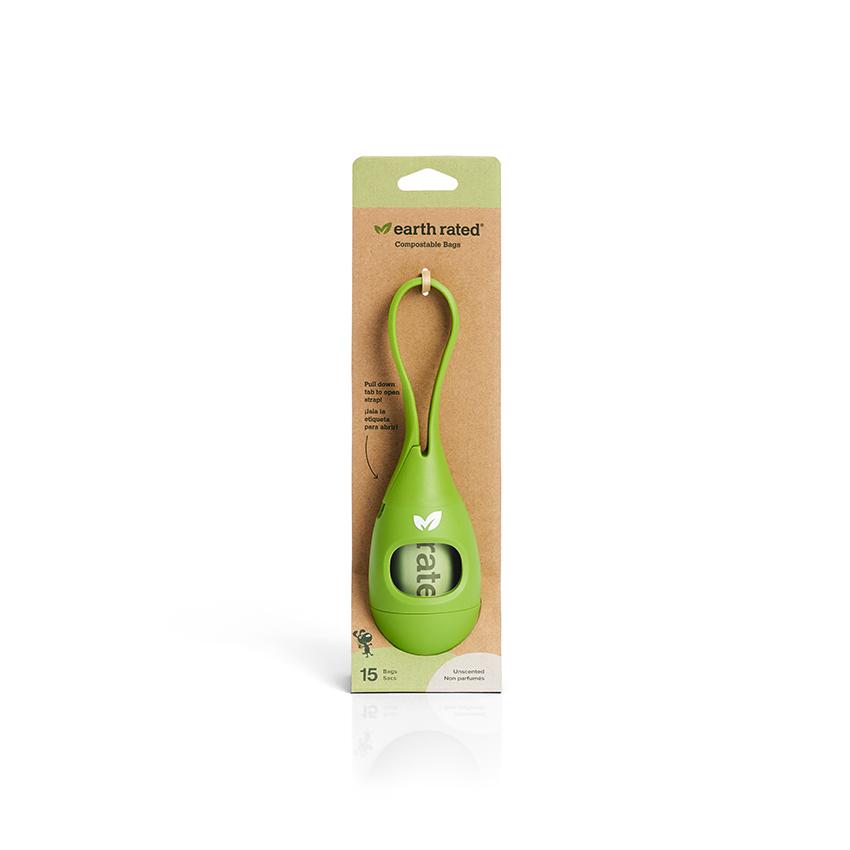 Bright green silicone tea drop shaped dog poo bag dispenser in cardboard packaging.