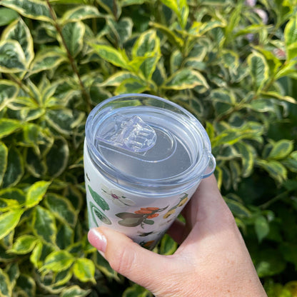 White reusable coffee mug with native New Zealand flora and fauna print.