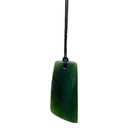 Greenstone freeform pendant on a black wax cord.