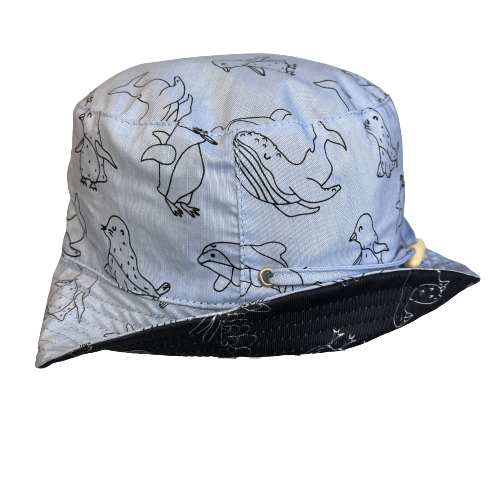 Bucket hat in denim blue with animal outlines in black.