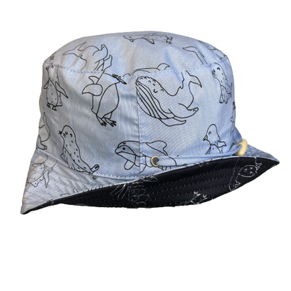 Bucket hat in denim blue with animal outlines in black.