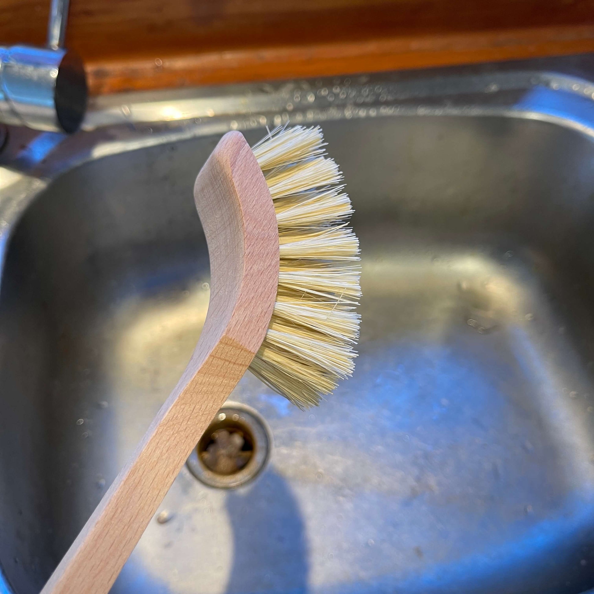 Wooden dish brush.