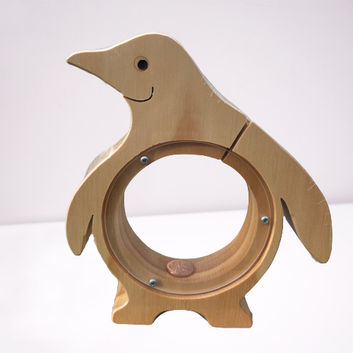 Natural wood penguin shaped money box.