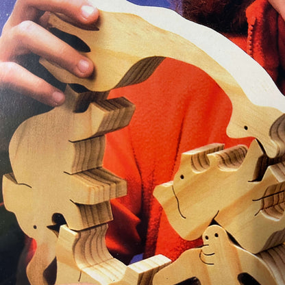 Close up of balancing wooden animals.