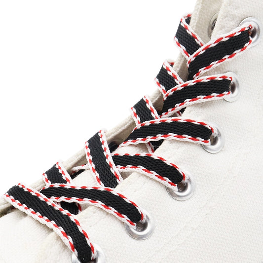 Black shoelaces with red and white edging.